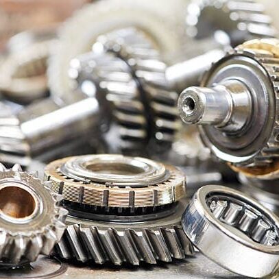 Quality Belts Bearings and Electrical Components Close-up of industrial metal gears and bearings.